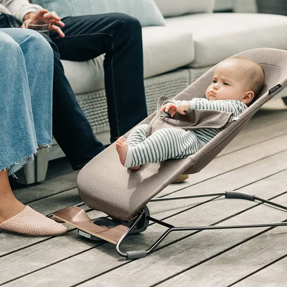 Infant securely fastened in the bouncer